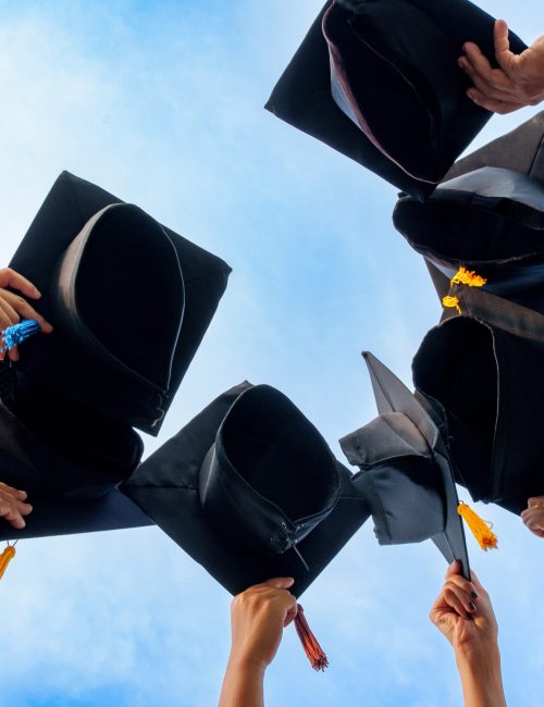Graduation Caps Thrown in the Air success graduates of the university,Concept education congratulation graduates in University.