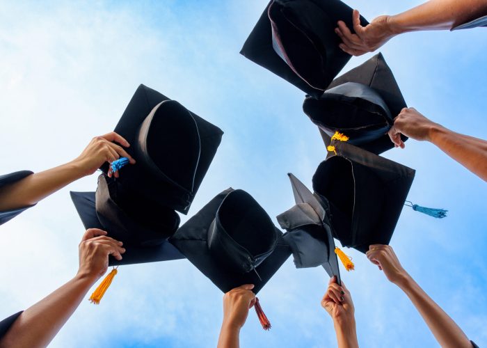 Graduation Caps Thrown in the Air success graduates of the university,Concept education congratulation graduates in University.